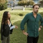 Casal discutindo em um parque, simbolizando desafios de comunicação no relacionamento.
